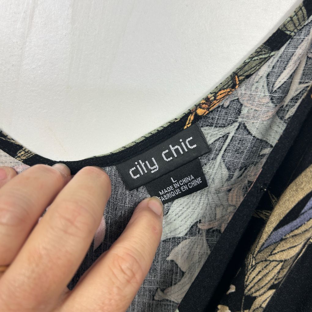 City Chic label detail view on grey patterned garment
