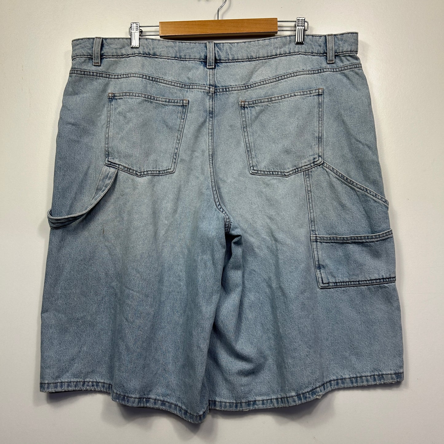 Light blue denim cargo shorts back view
