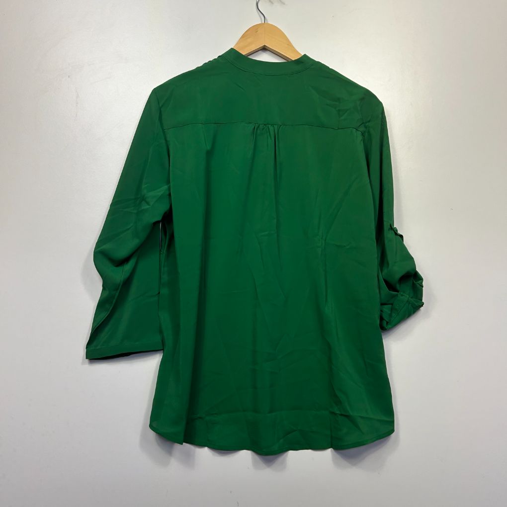 Green shirt back view