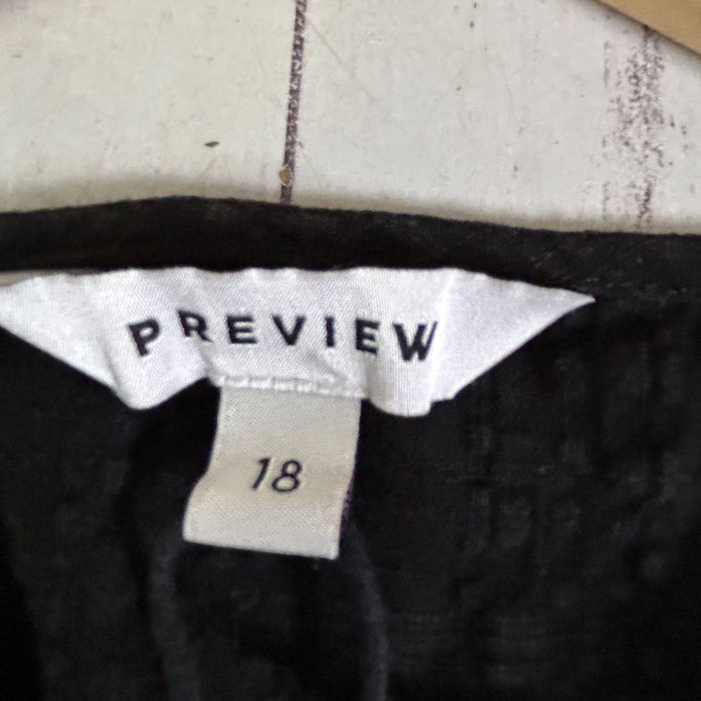 Black pants label detail showing Preview brand size 18