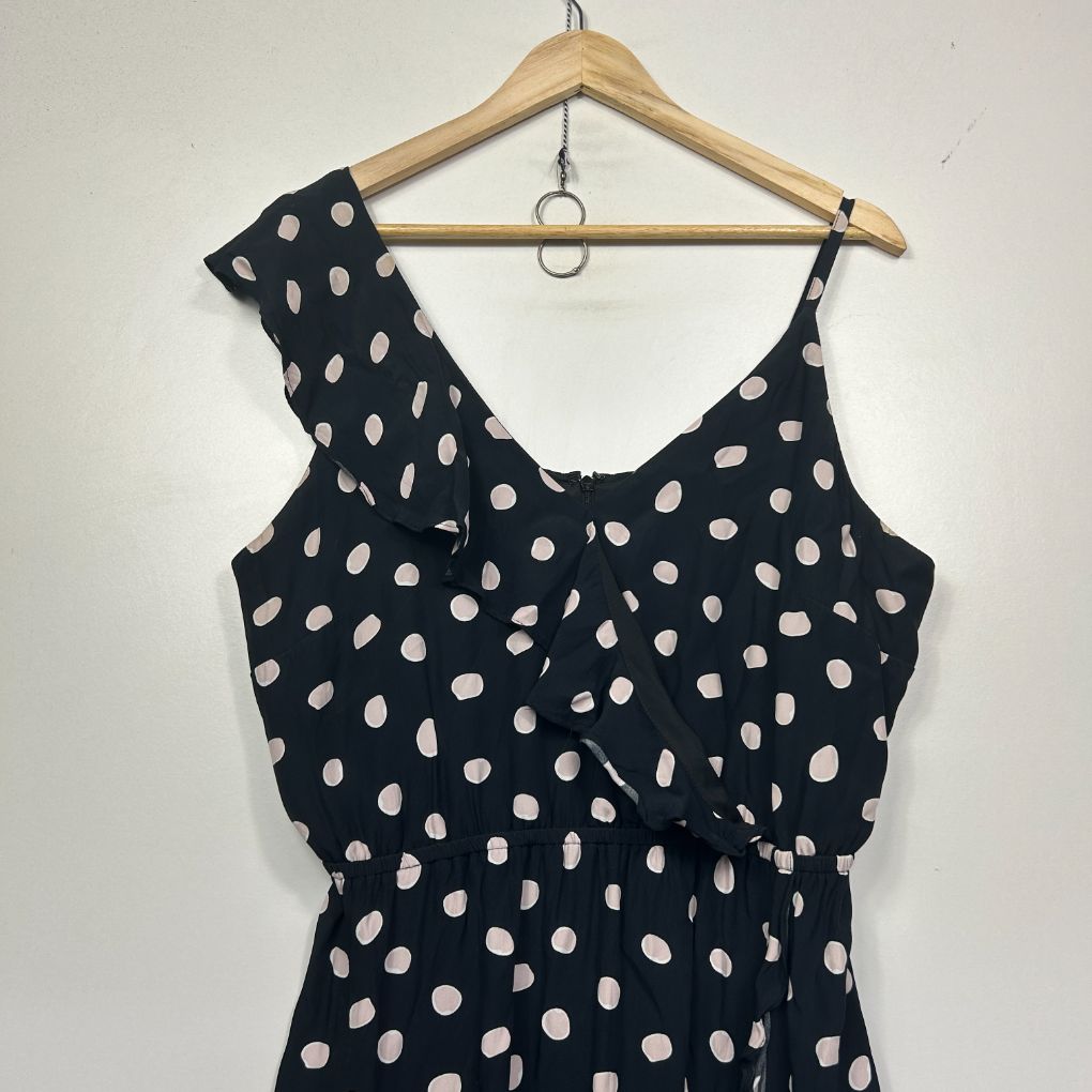 Black and white polka dot sleeveless dress front view