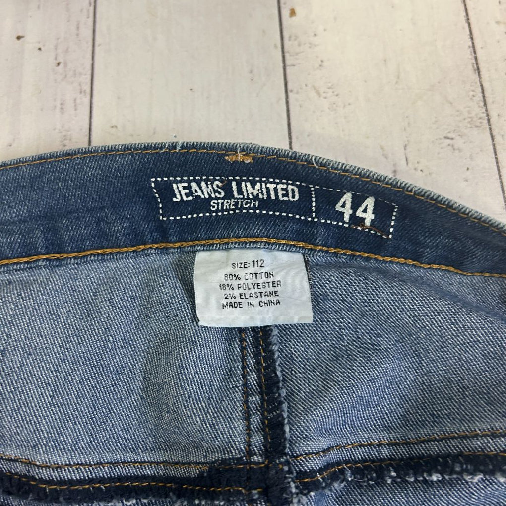 Blue denim jeans label and waistband detail view