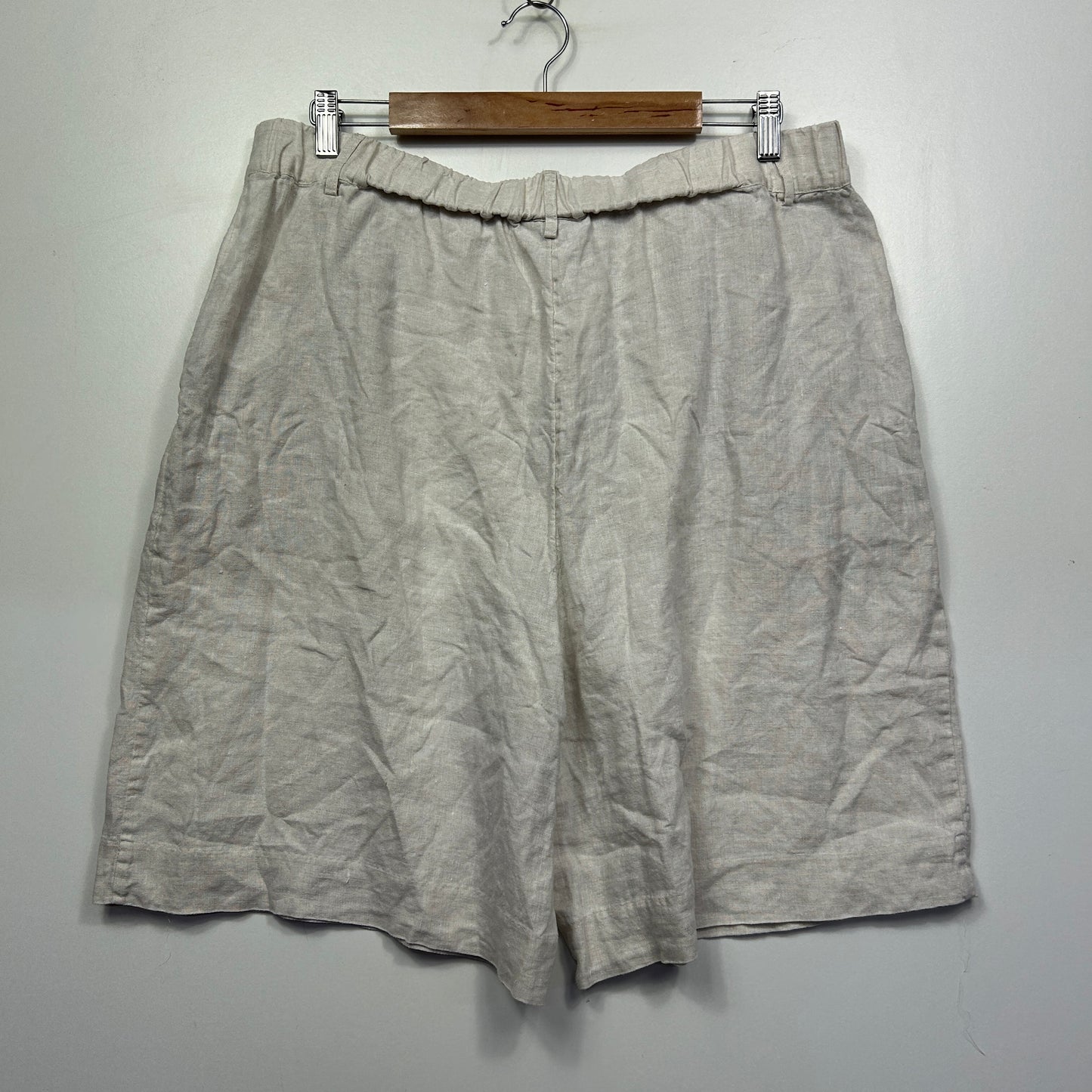 Beige linen shorts front view