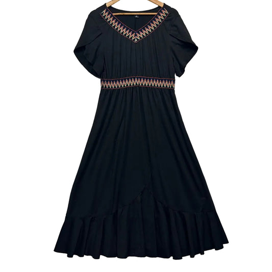 Black dress front view with geometric neckline detail