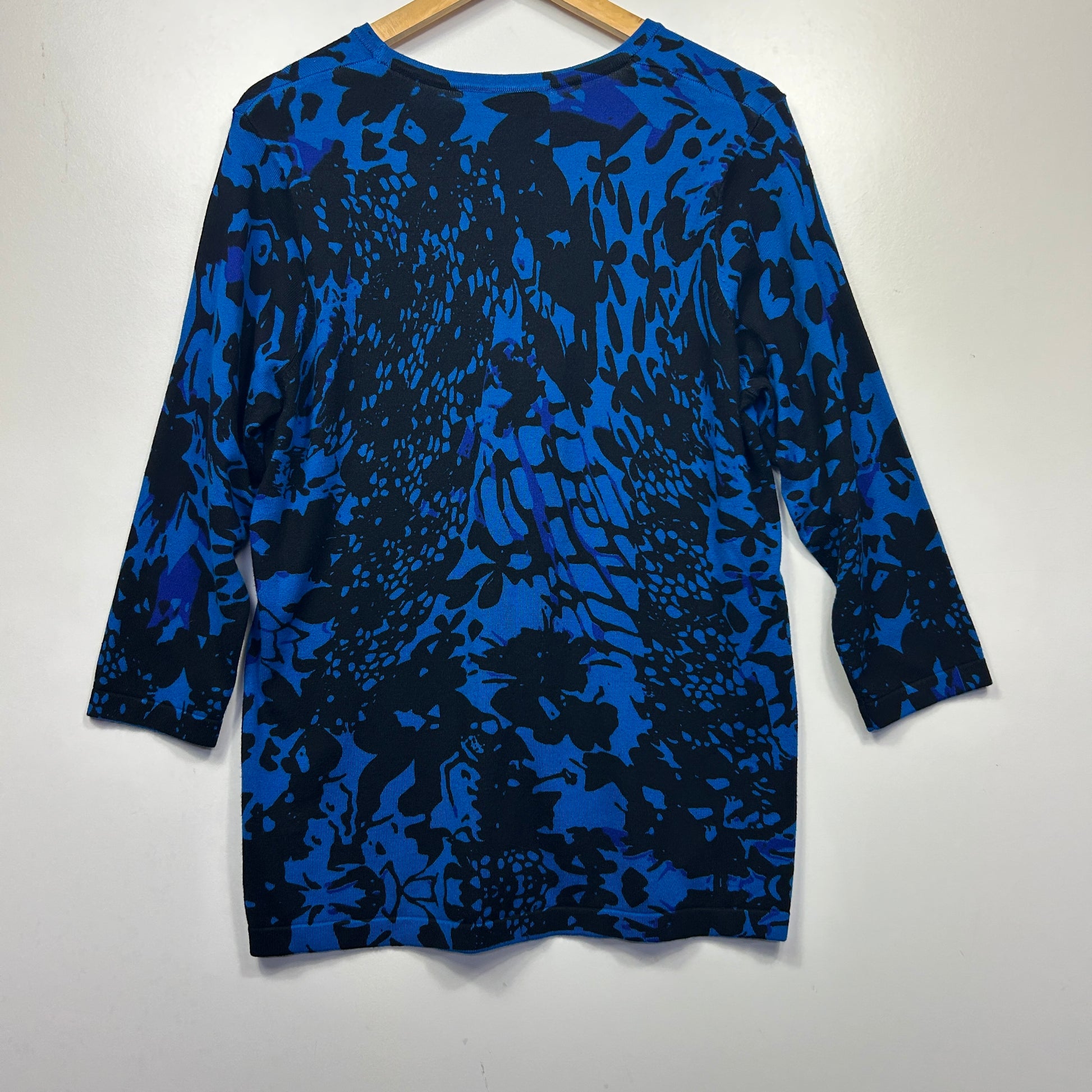 Blue and black abstract patterned long sleeve top front view