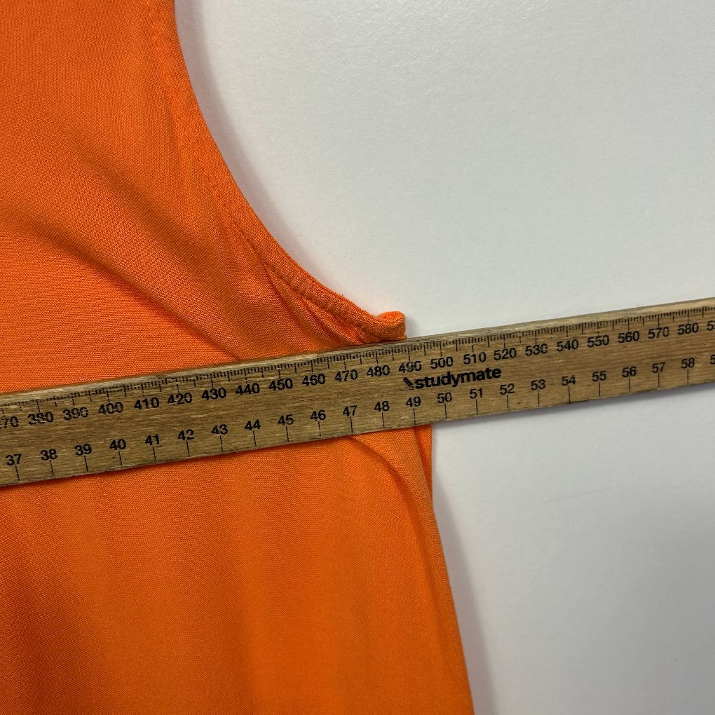 Orange fabric with measuring tape detail view