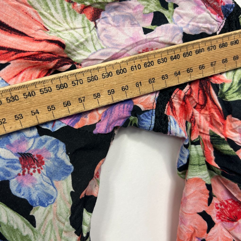 Floral fabric with measuring tape detail view