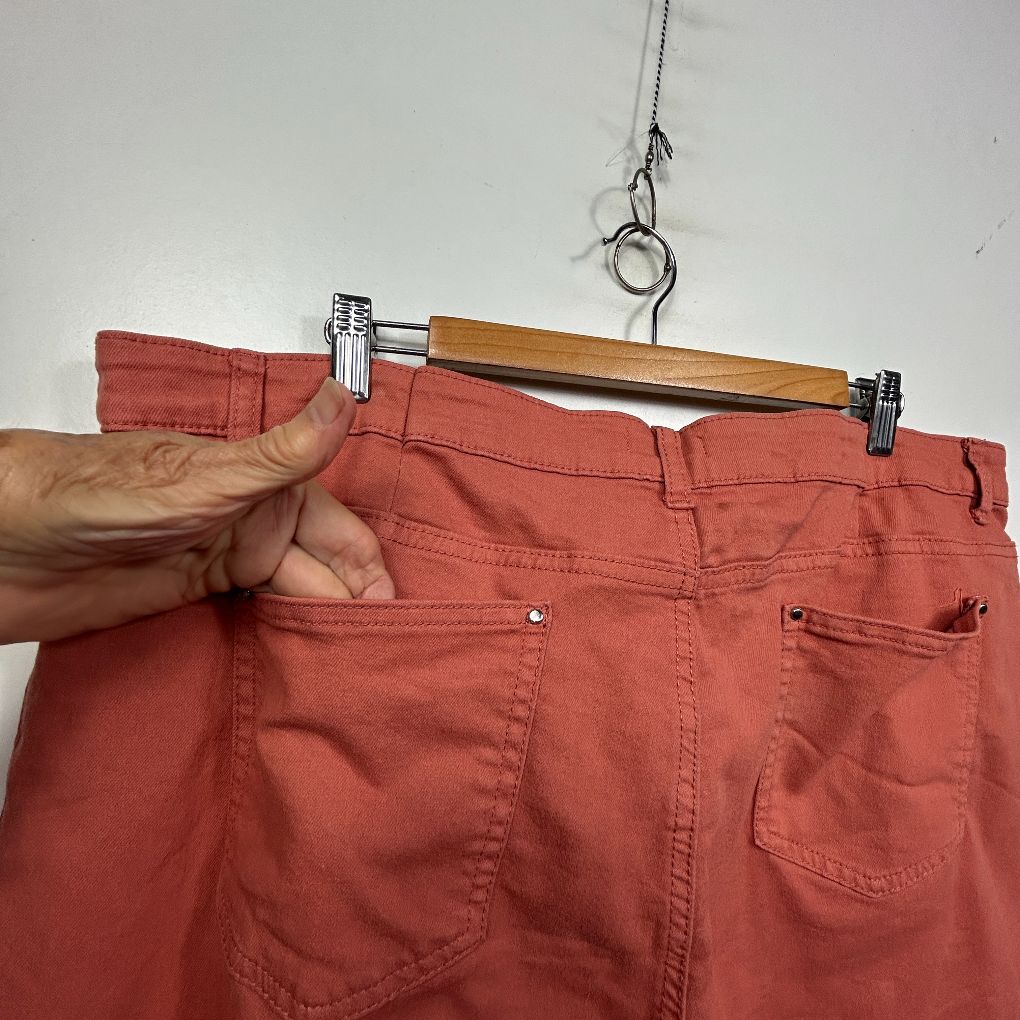 Red pants front view on hanger