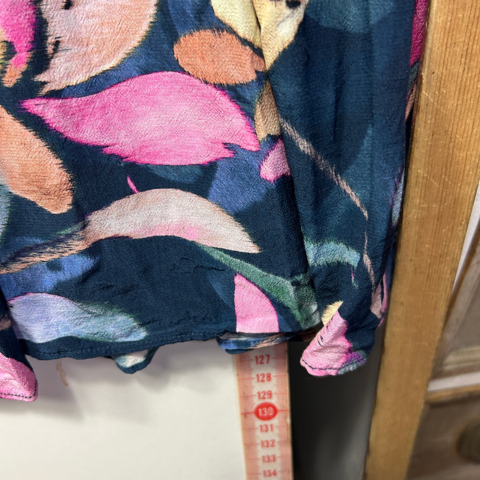 Colorful abstract patterned sweater detail view