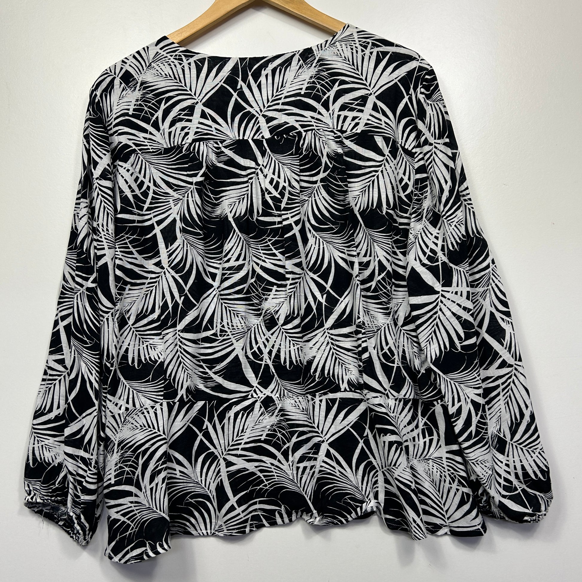 Black and white leaf print long sleeve top front view