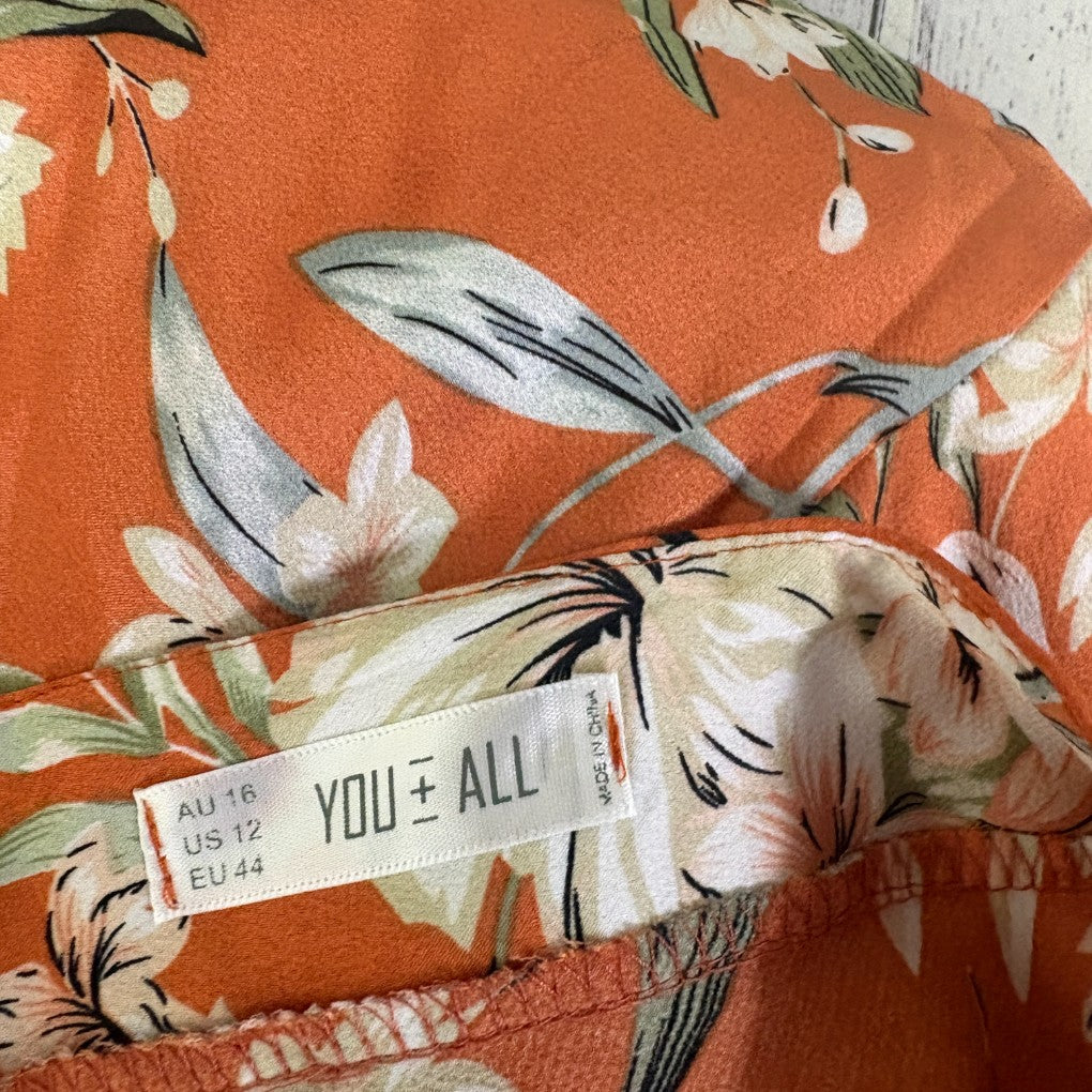 Orange floral shirt detail view