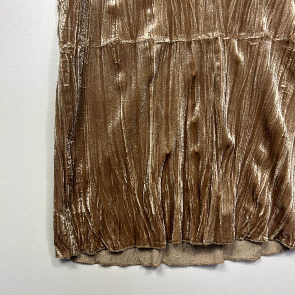 Gold pleated top detail view