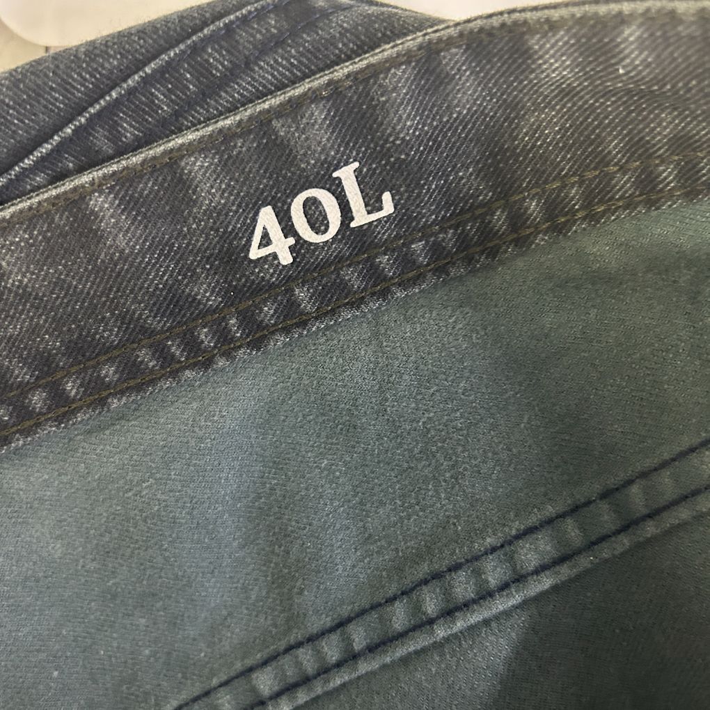 Grey and black backpack 40L capacity label detail view