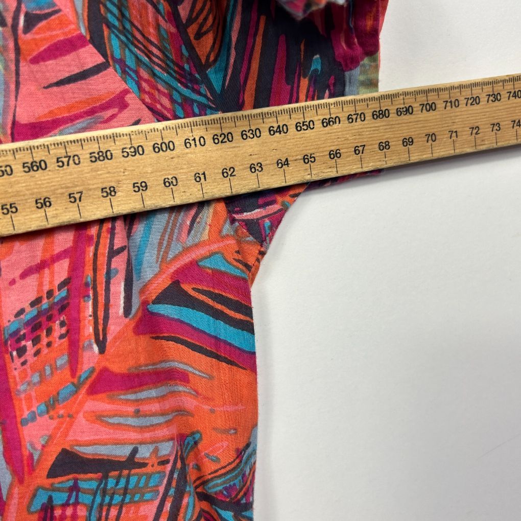 Colorful graphic print fabric with measuring tape detail view