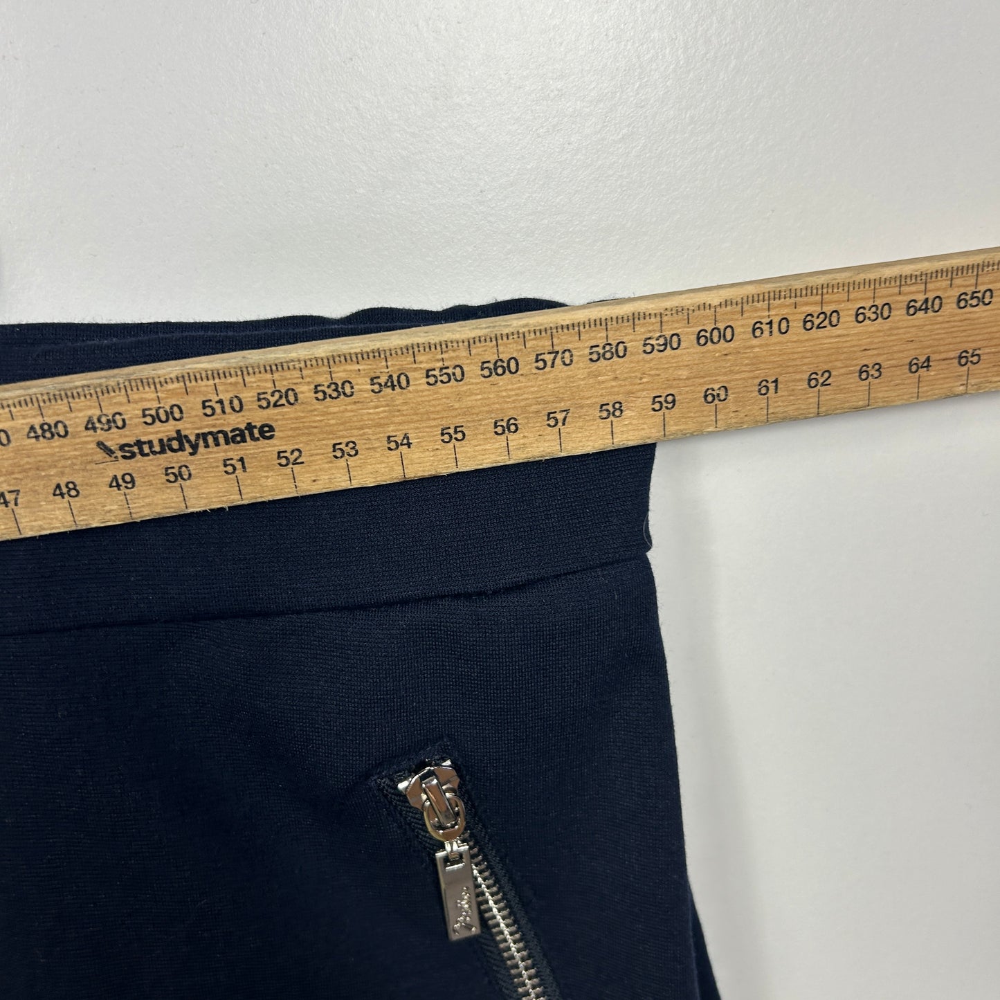 Navy pants front view with measuring tape detail
