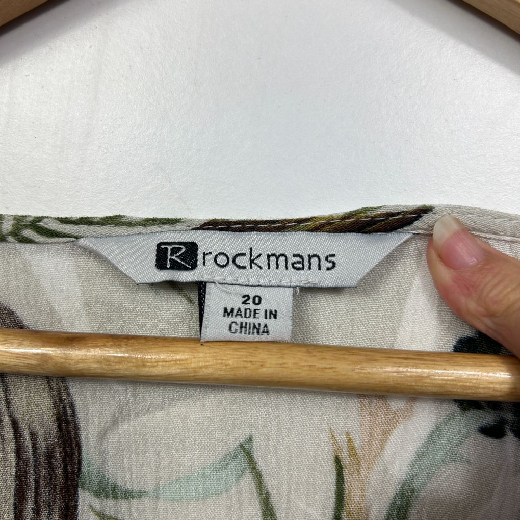 Cream and green floral shirt label detail view