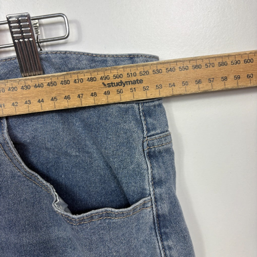 Blue jeans waistband detail with measuring tape