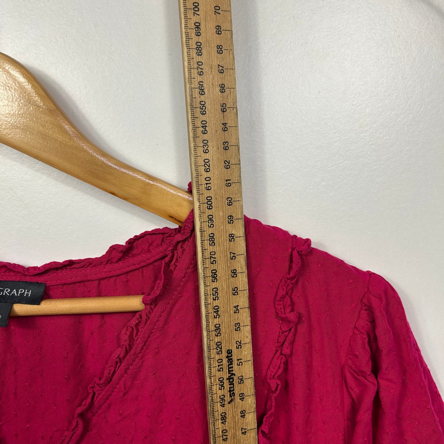 Burgundy top front view with ruffle detail