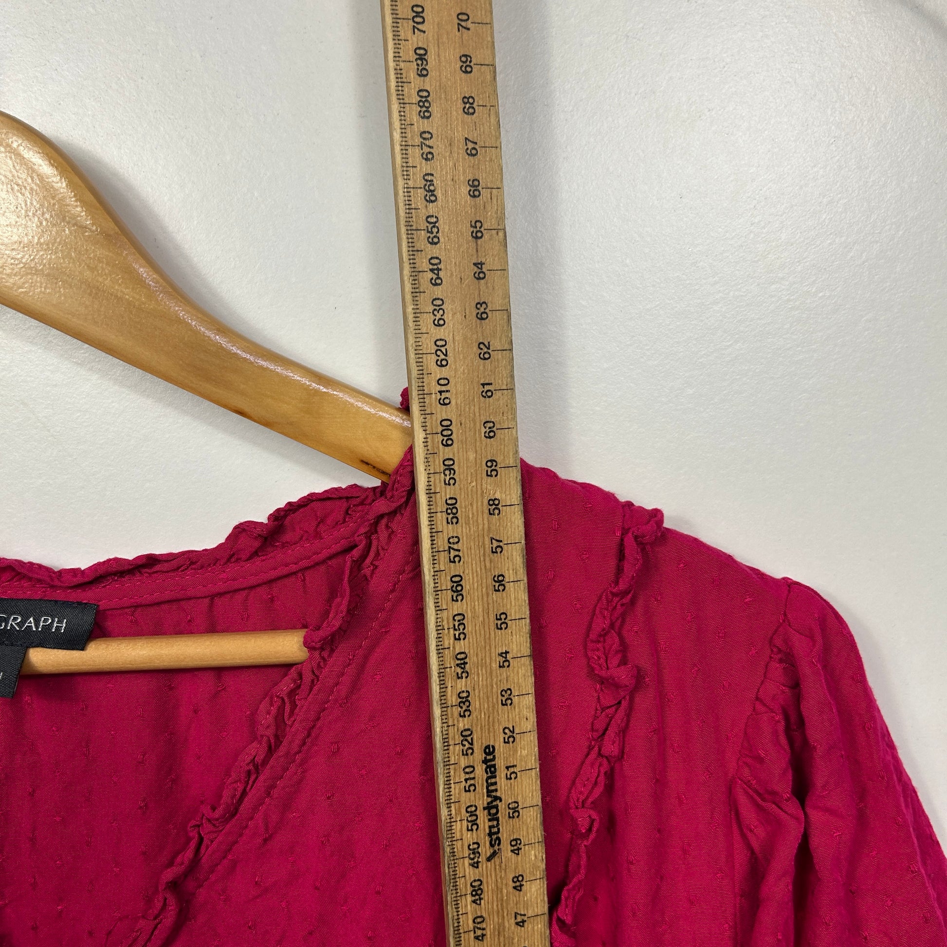 Burgundy top front view with ruffle detail