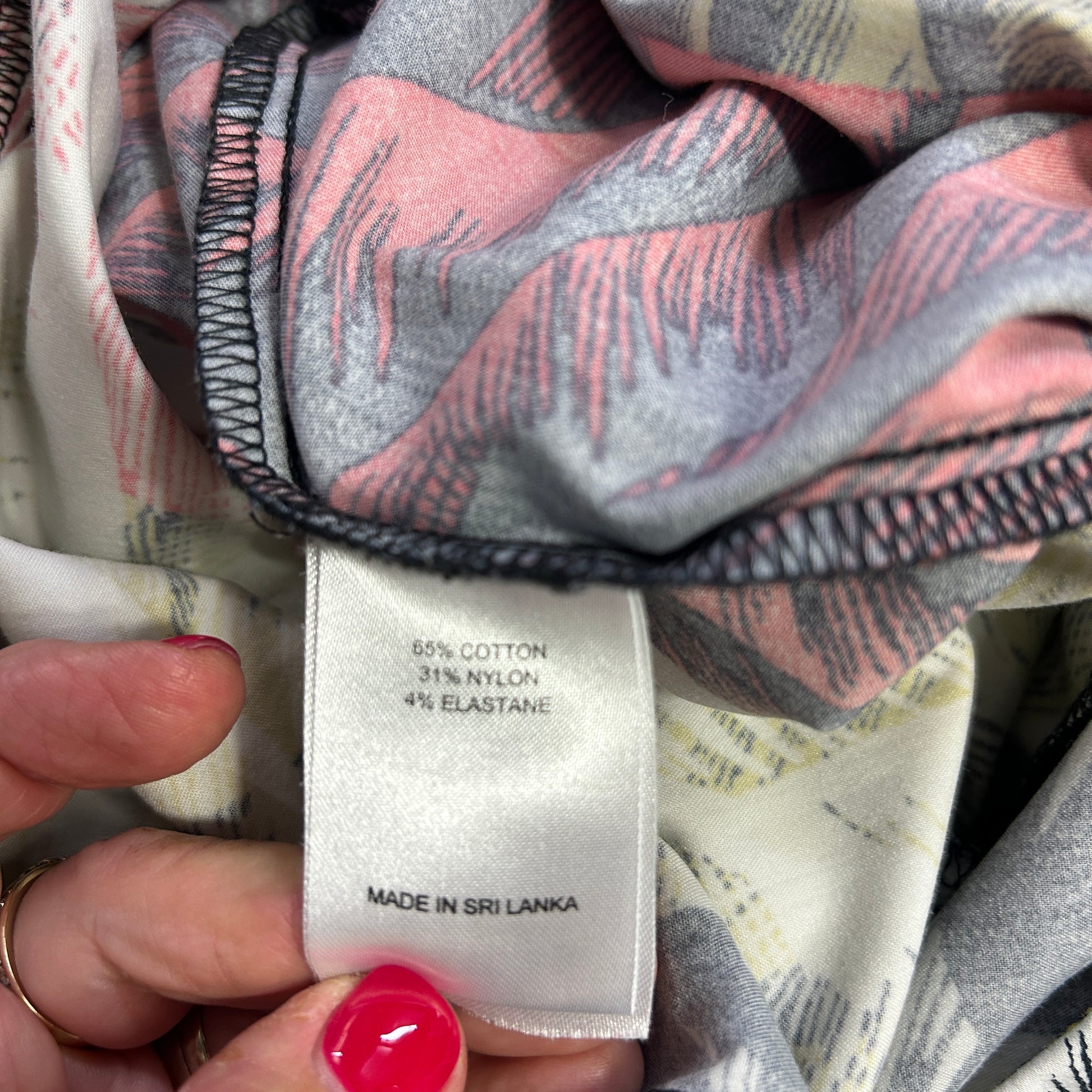 Grey and pink striped scarf label detail