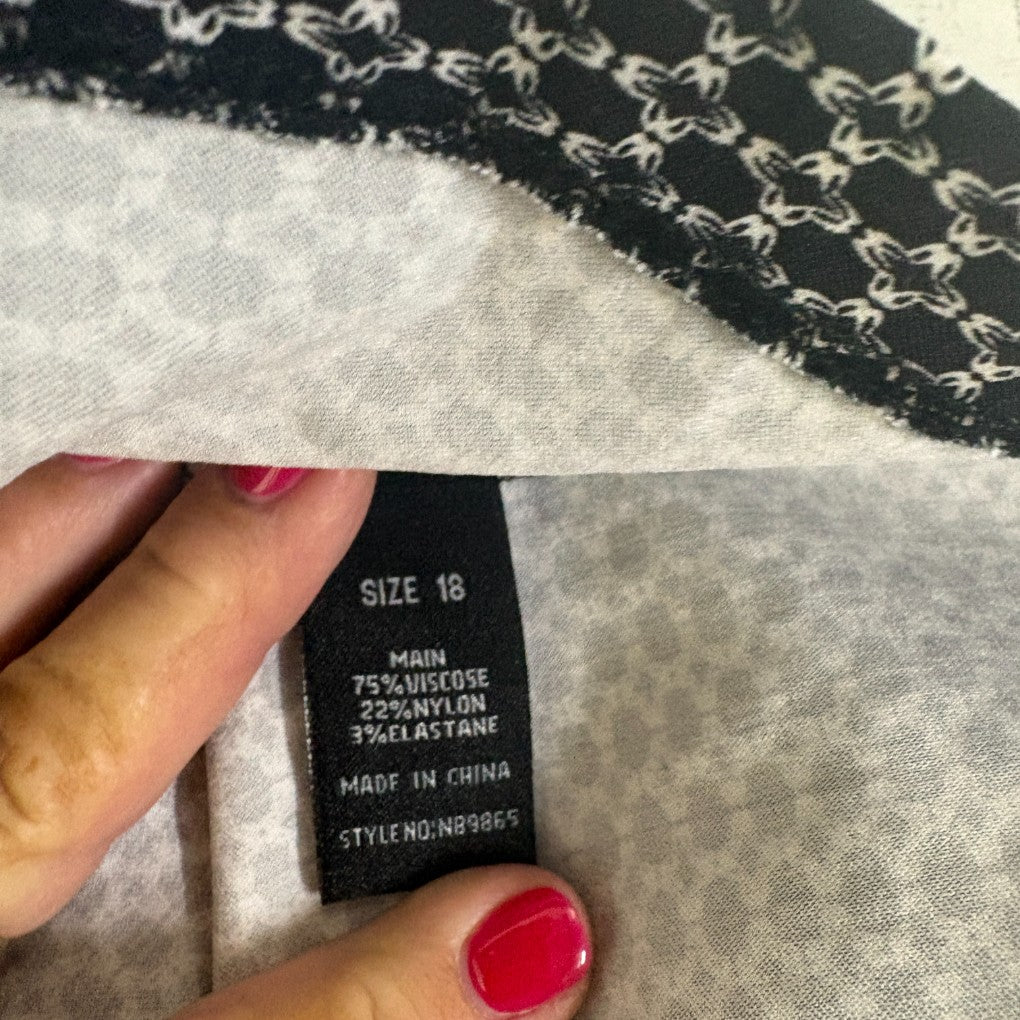 Black and white knit jumper label detail showing size 18