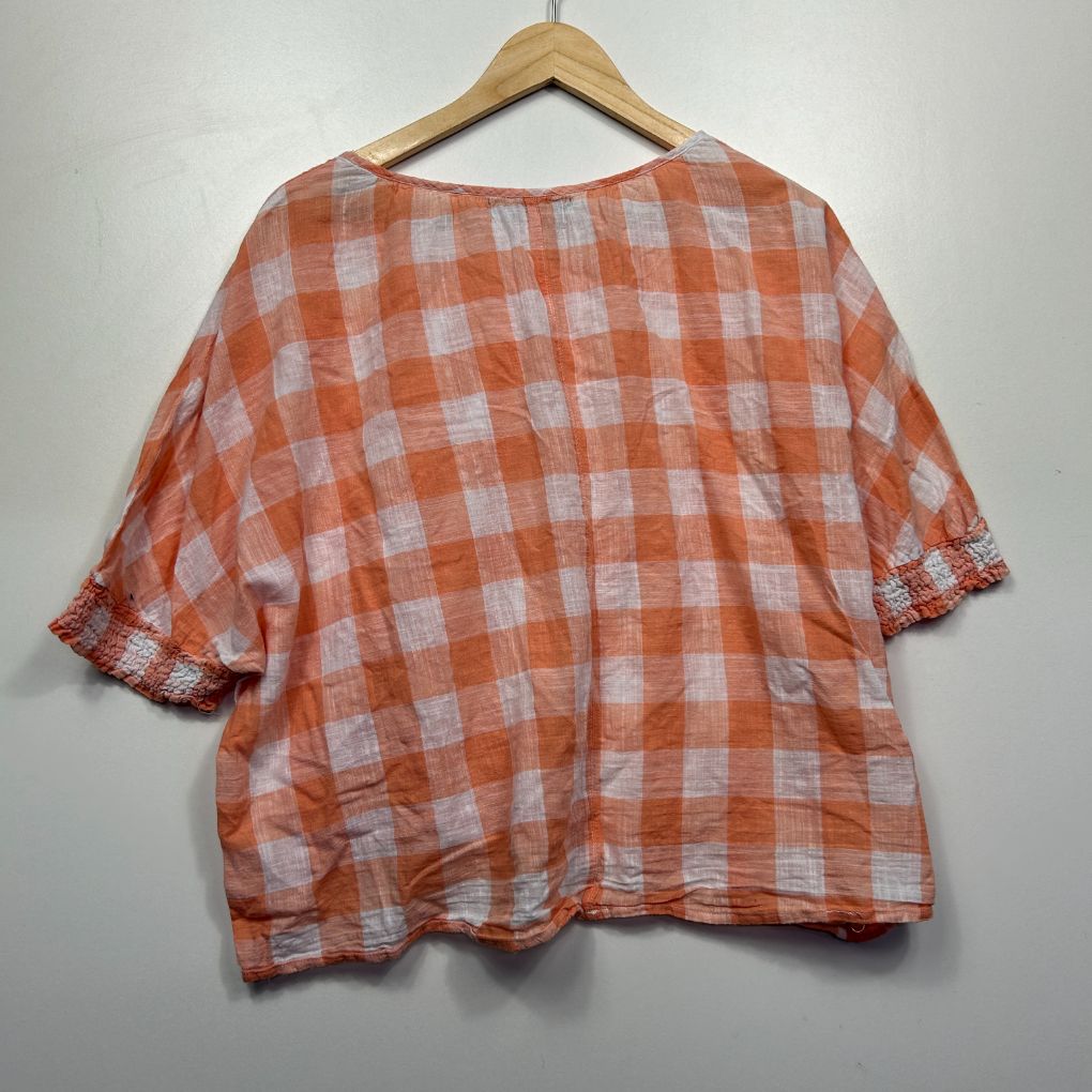 Orange and white checkered t-shirt back view