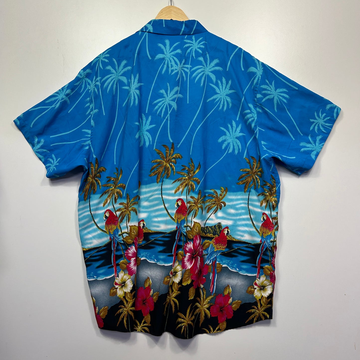 Blue Hawaiian shirt back view with palm tree pattern