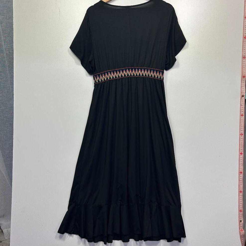 Black dress front view with patterned waist detail