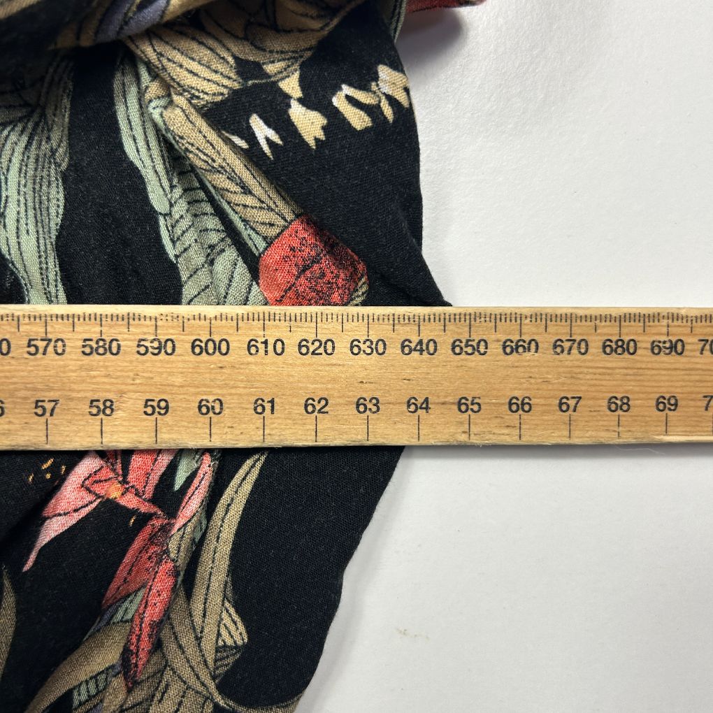 Black fabric with floral and graphic design detail view
