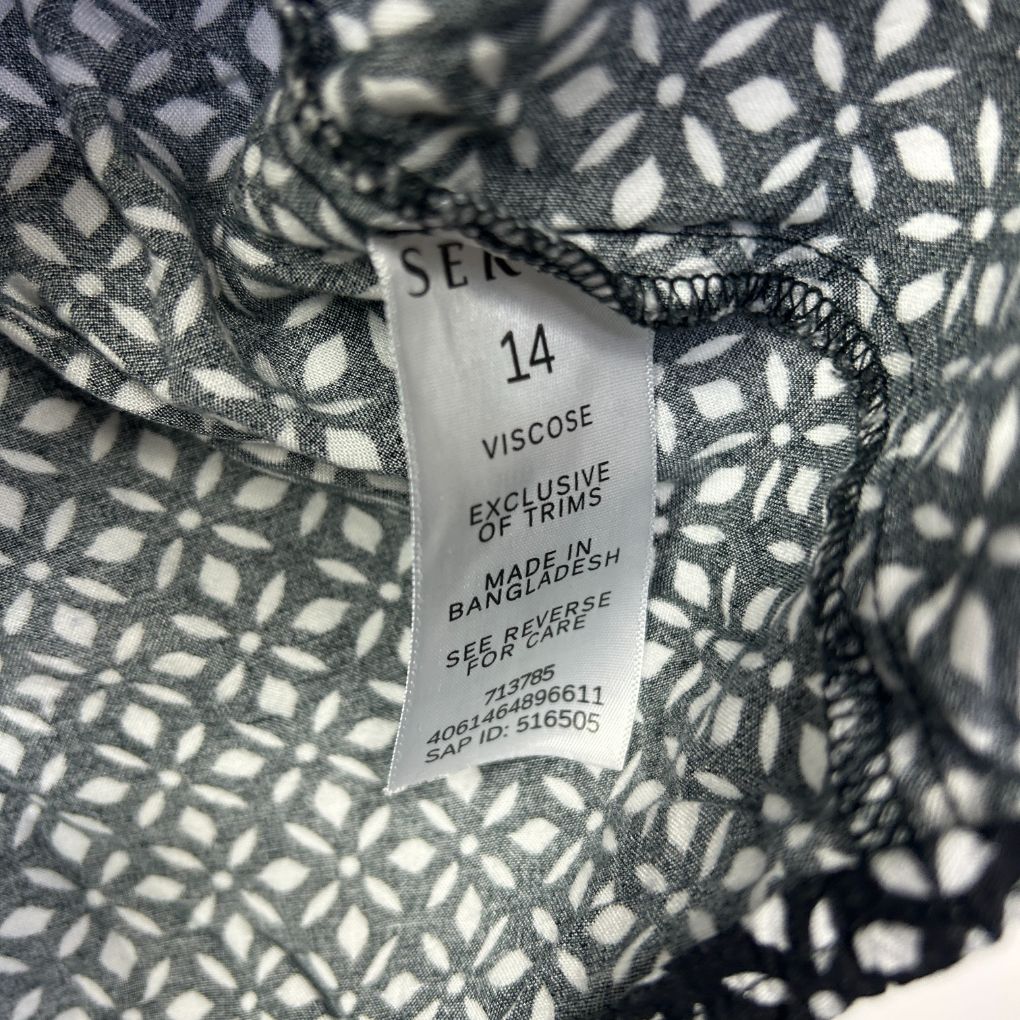 Black and white patterned fabric label detail view
