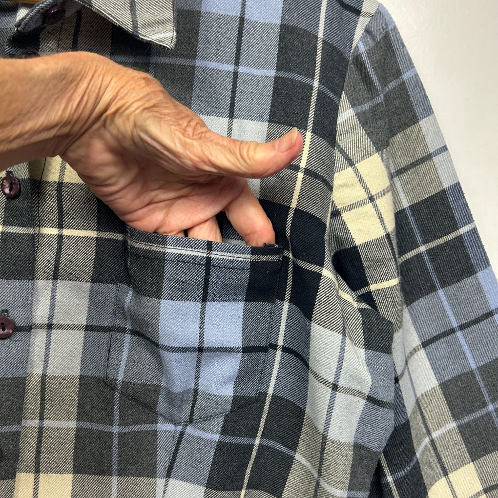 Grey and white checked shirt front view with hand in pocket