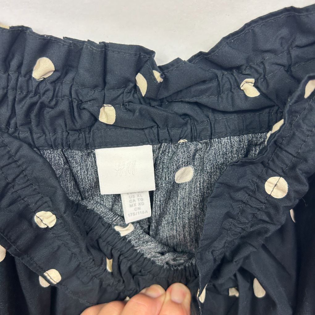Navy polka dot pants detail view