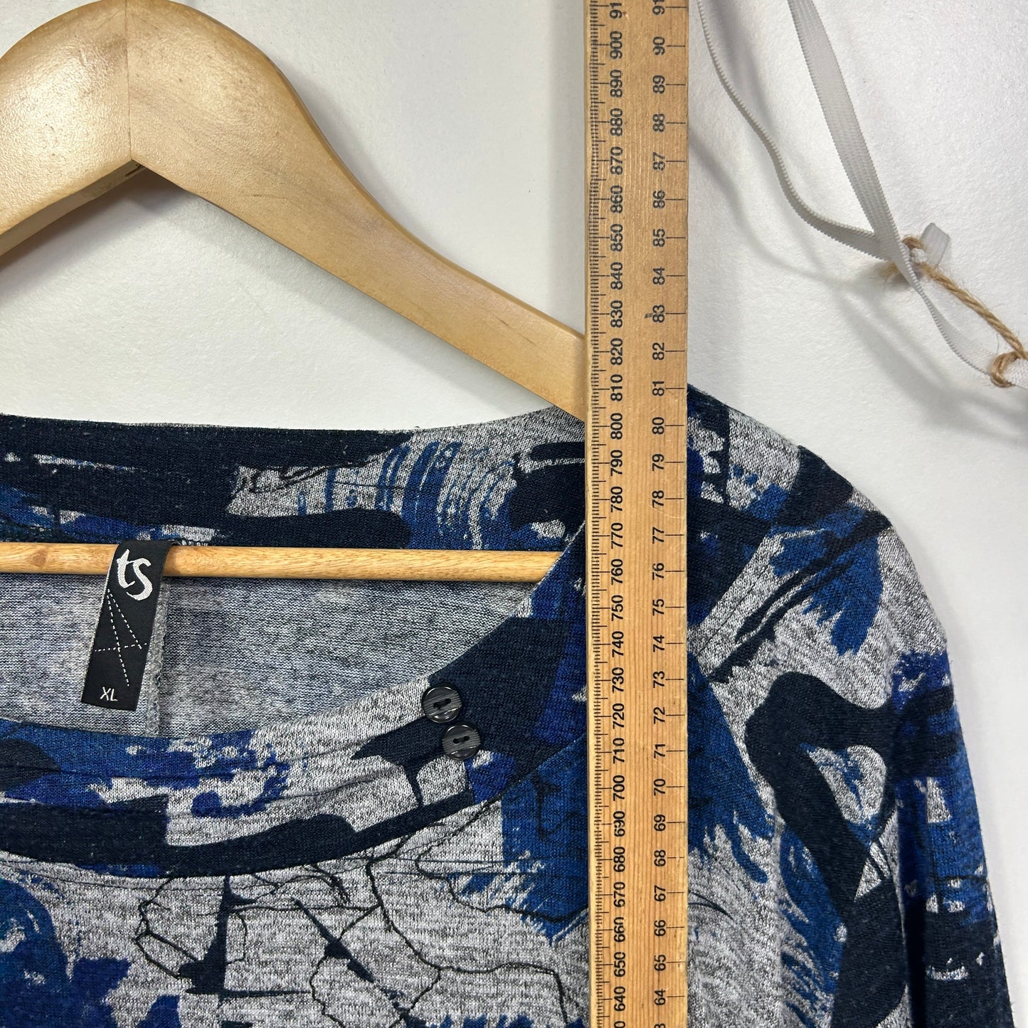 Navy and grey graphic print long sleeve top detail view