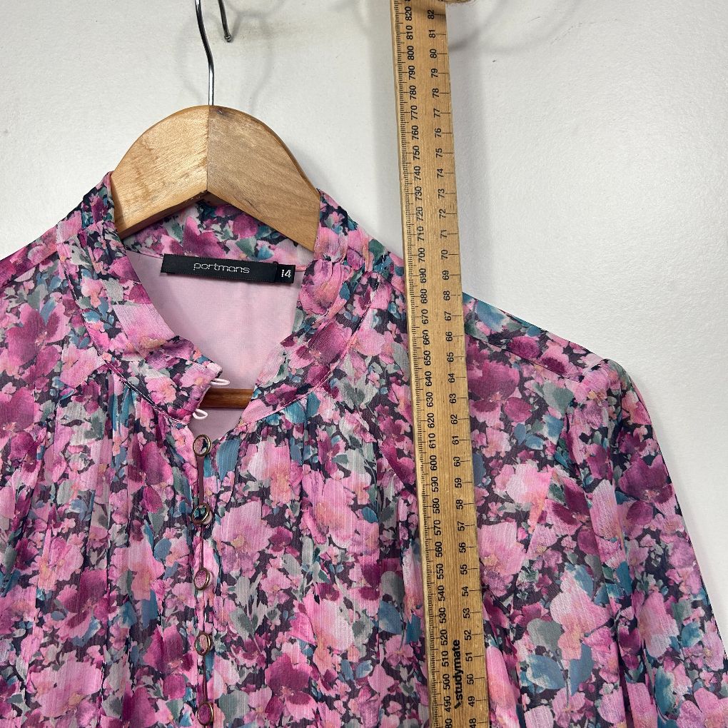 Pink floral shirt front view with measuring tape