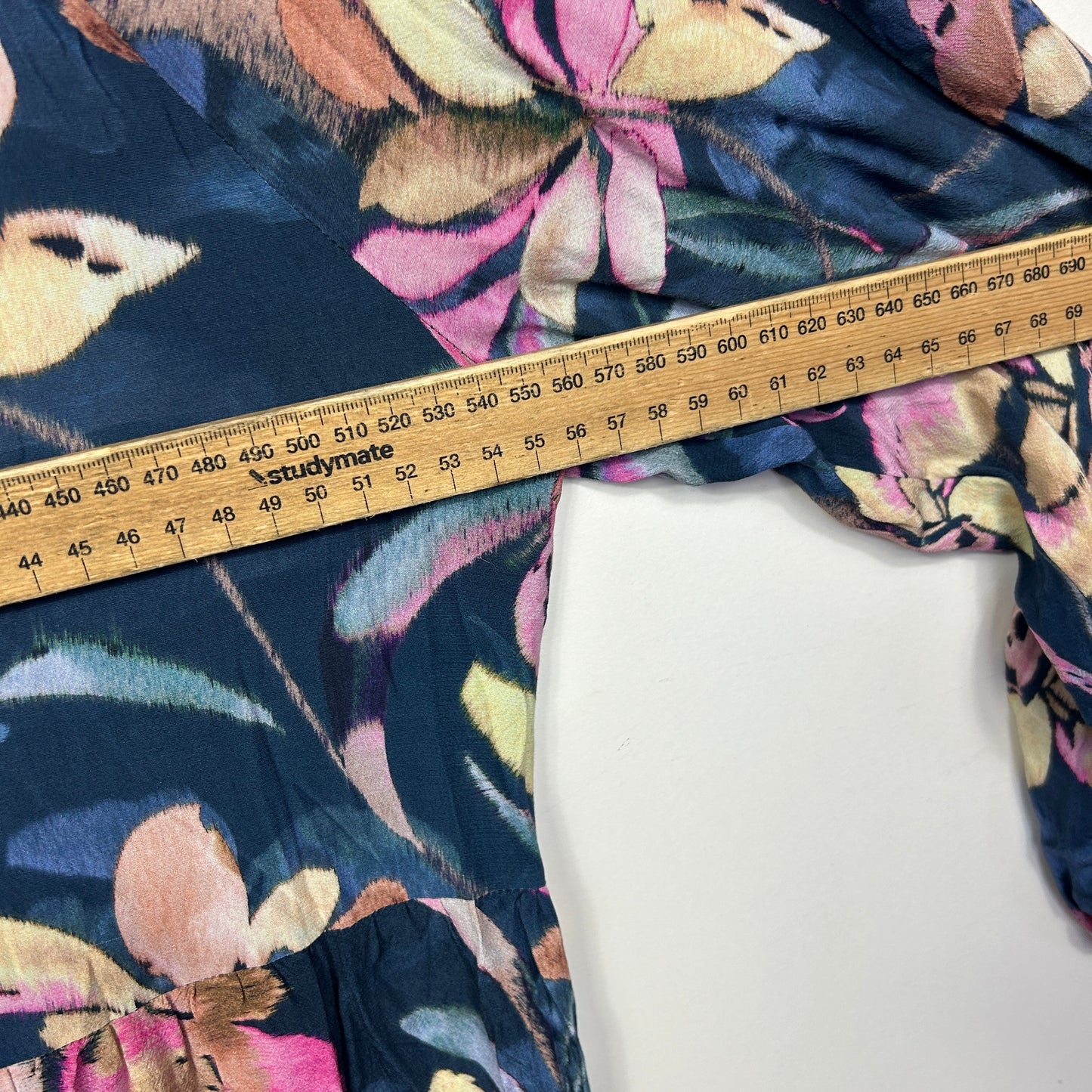 Navy floral fabric with measuring tape detail view