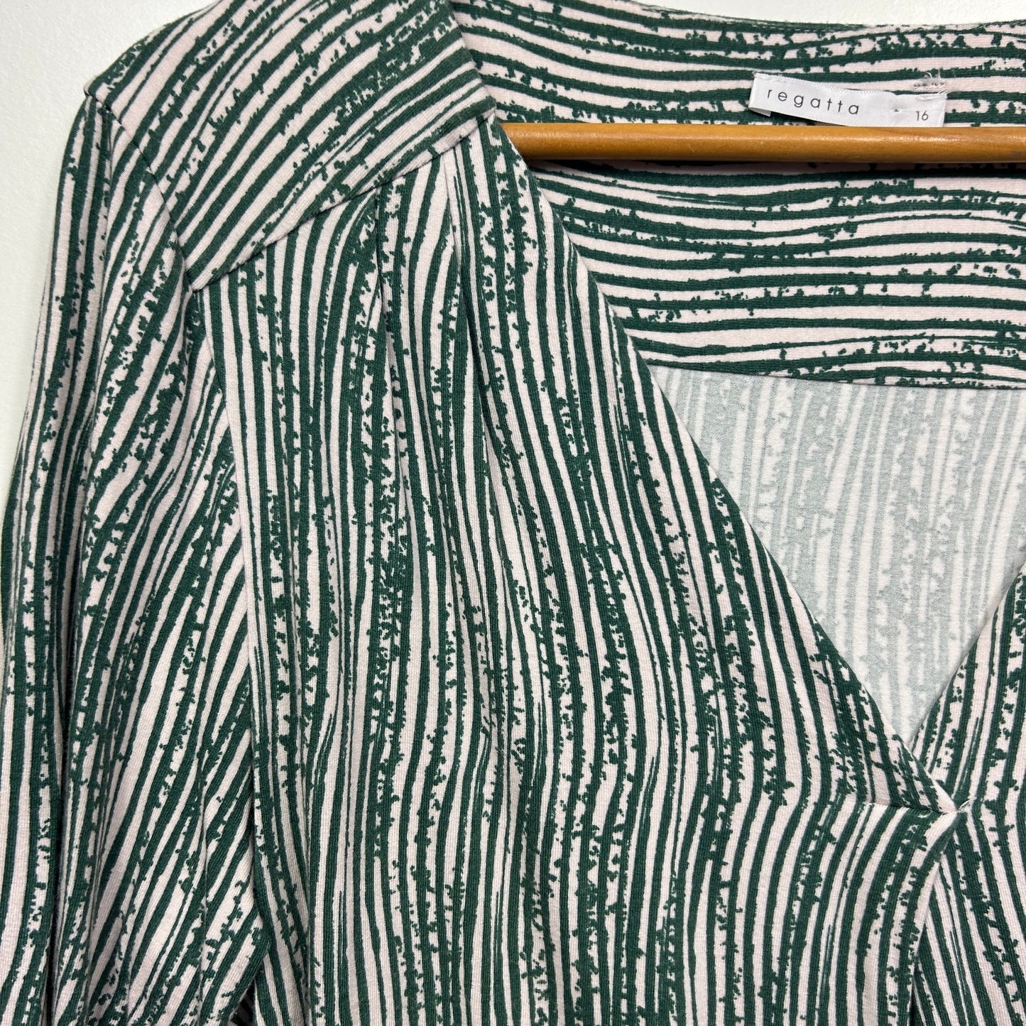 Green and white striped fabric detail view