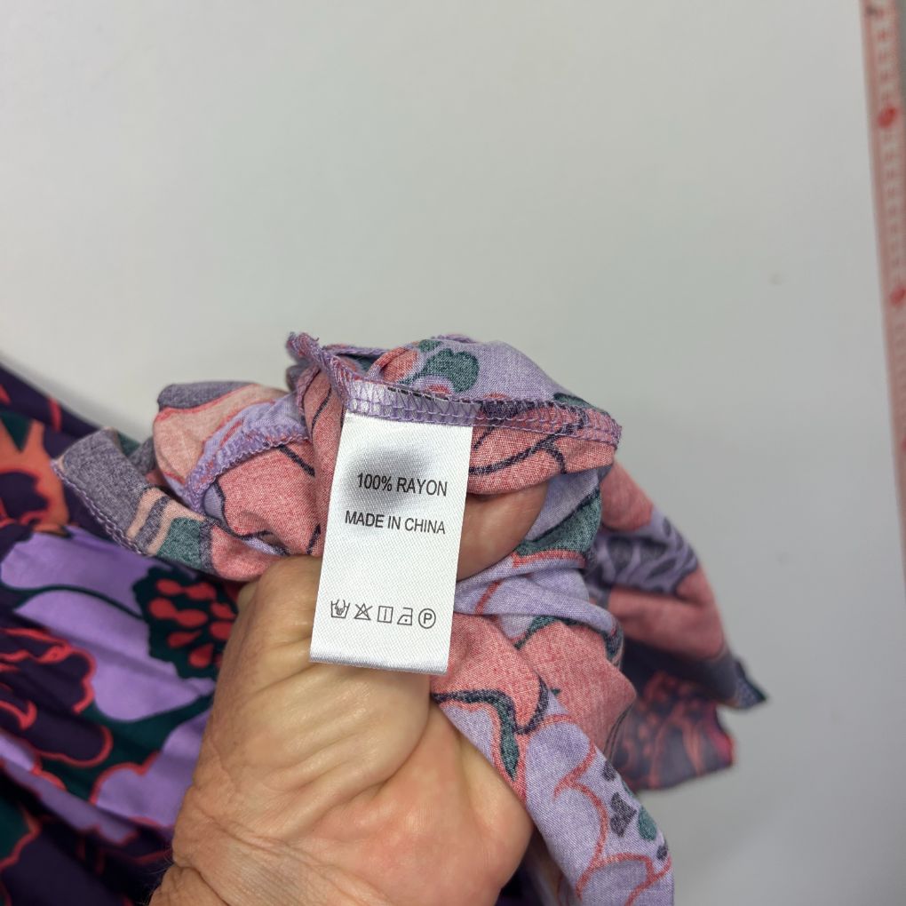 Multicolored patterned fabric detail view showing label
