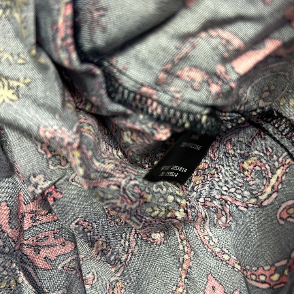 Grey fabric with floral paisley pattern detail view