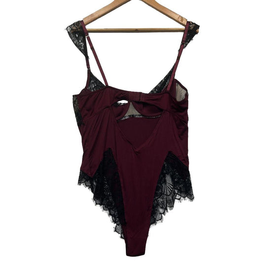 Burgundy bodysuit front view with black lace trim
