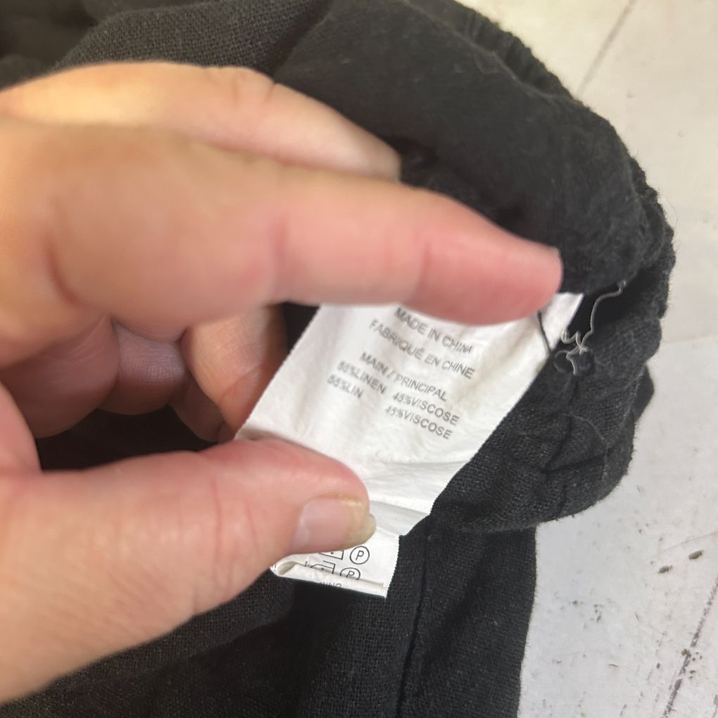 Black garment label detail view