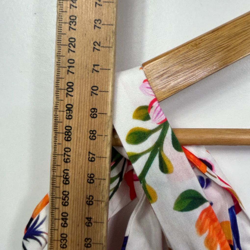 White fabric with colorful floral pattern detail view