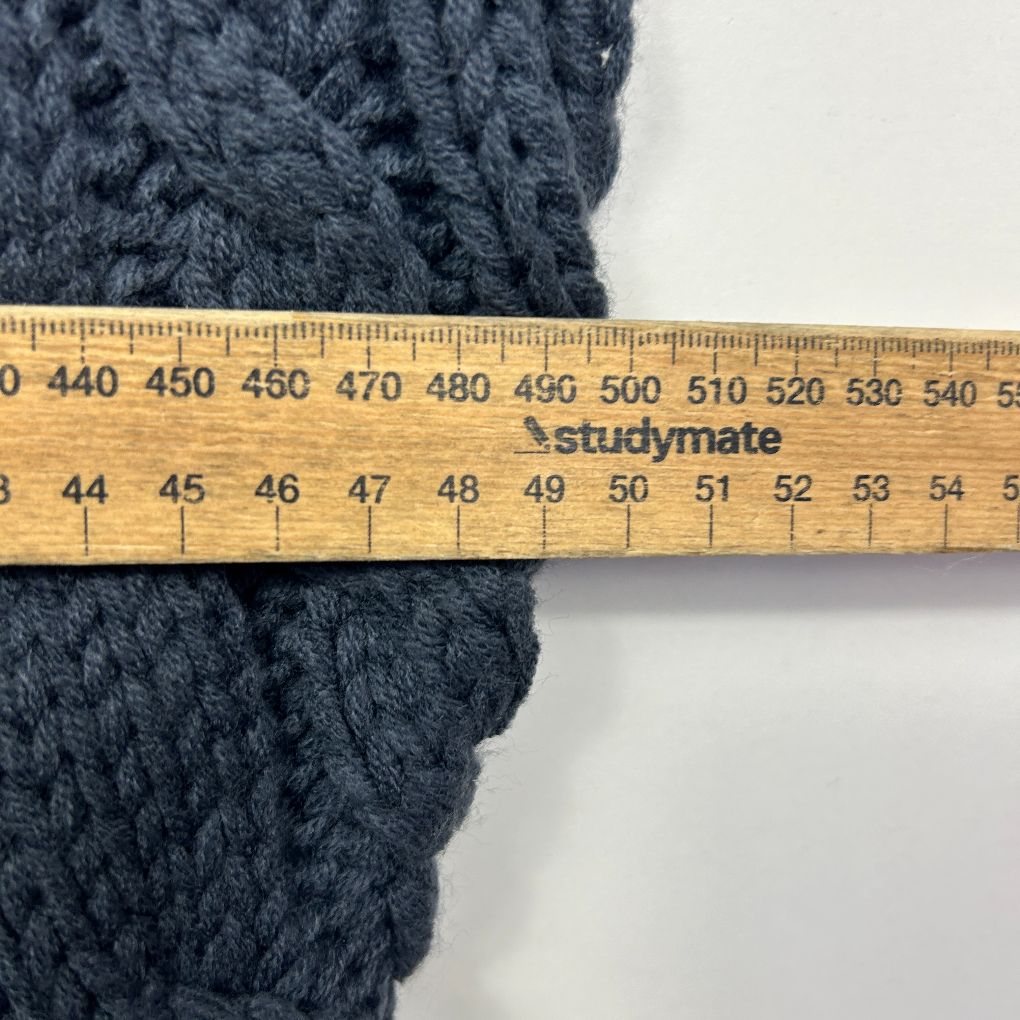 Dark grey knit fabric width measurement detail view
