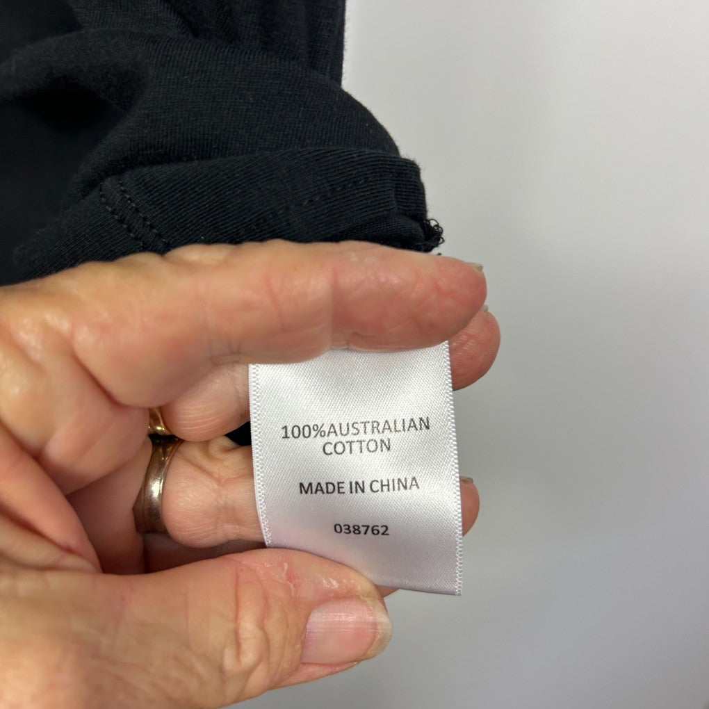 Black cotton garment label detail view
