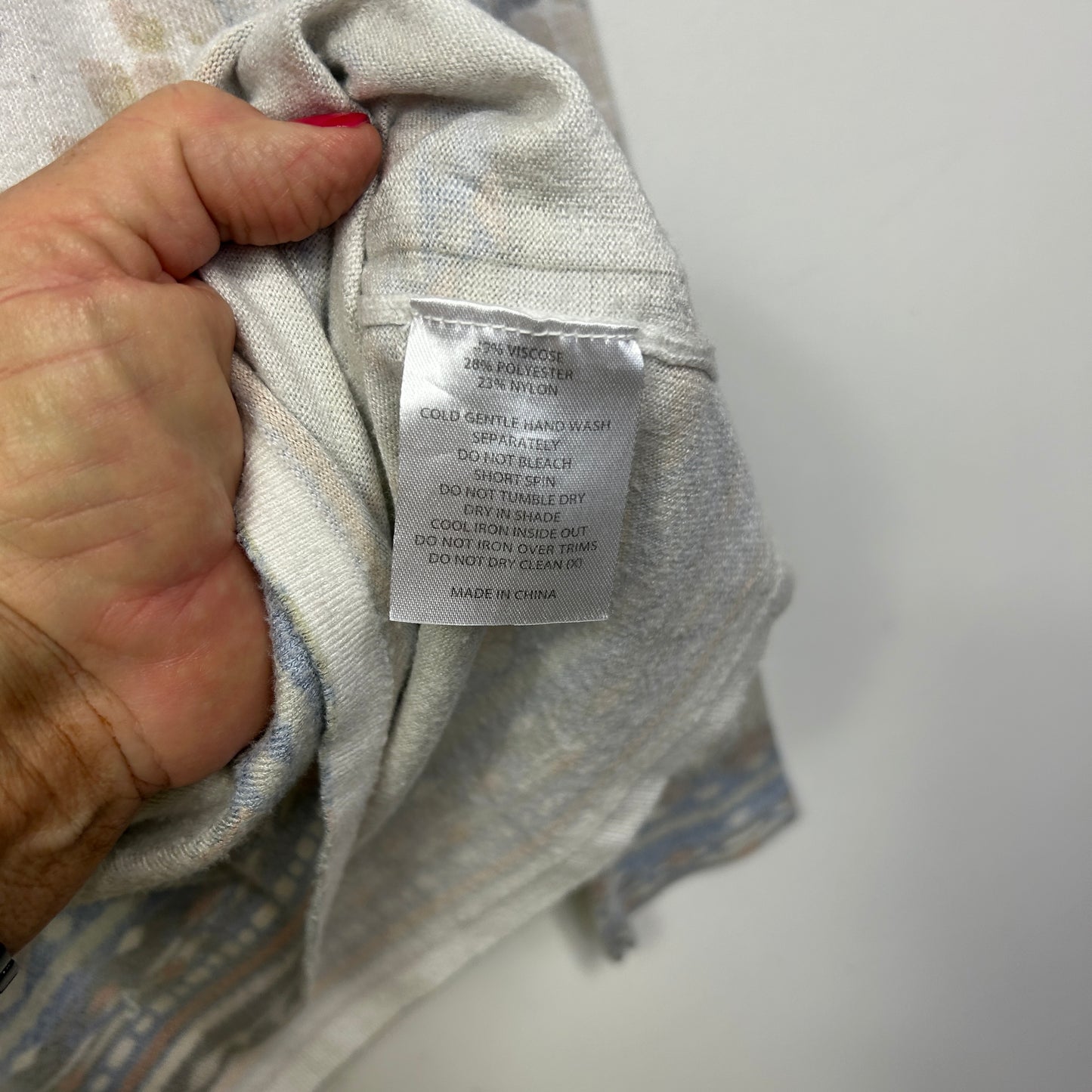 Grey shirt label detail view