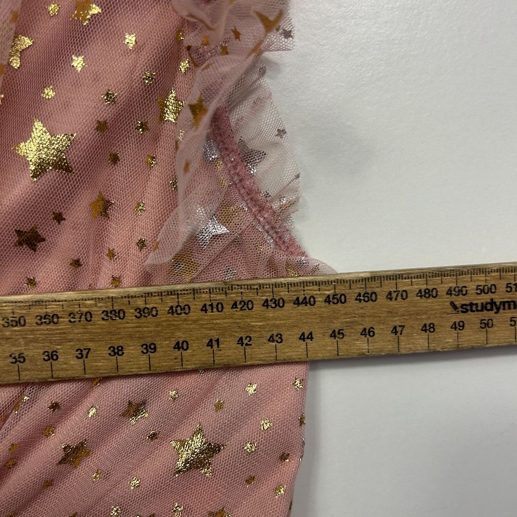 Pink tulle fabric with gold star sequins detail view