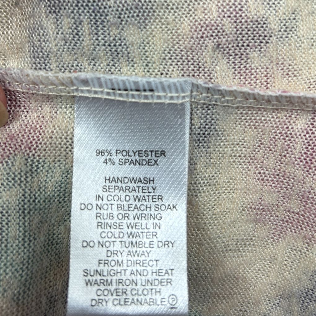 White garment care label detail view