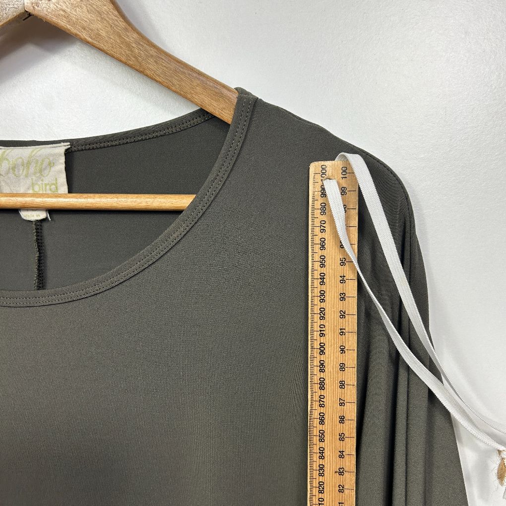 Olive green t-shirt front view on hanger with measuring tape