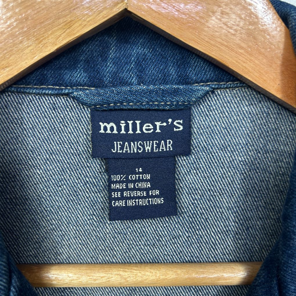 Blue denim jacket label detail view