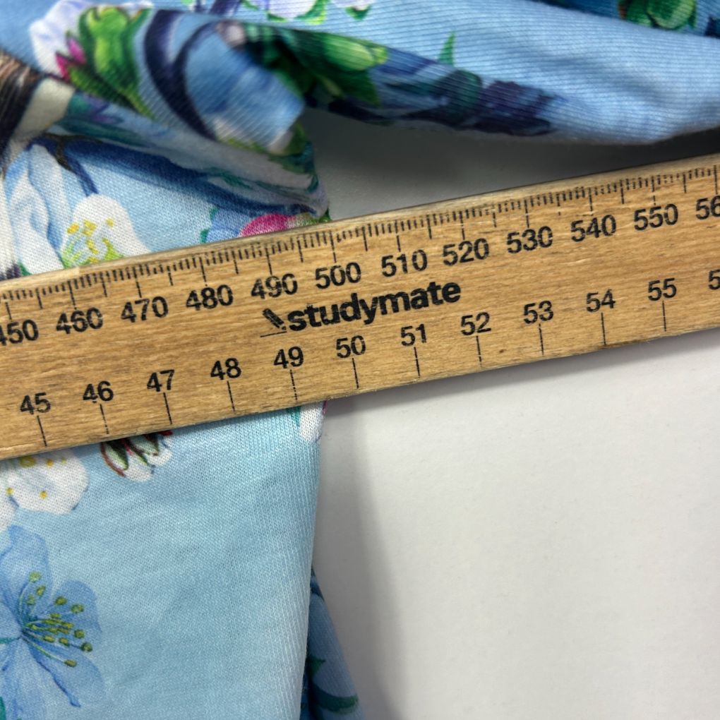 Blue floral fabric with measuring ruler detail view
