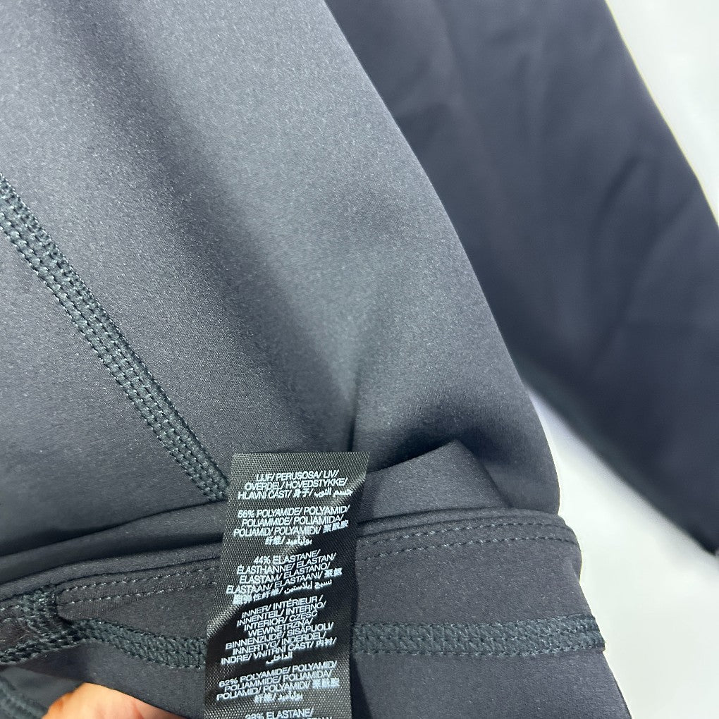Grey leggings detail view showing waistband and label